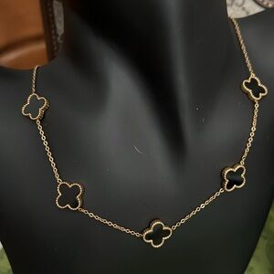 Elegant Black and Gold Clover Necklace